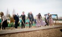 A small group of invited guests turn shovels of dirt for the groundbreaking for the Grand Junction Colorado Temple in Grand Junction, Colorado.