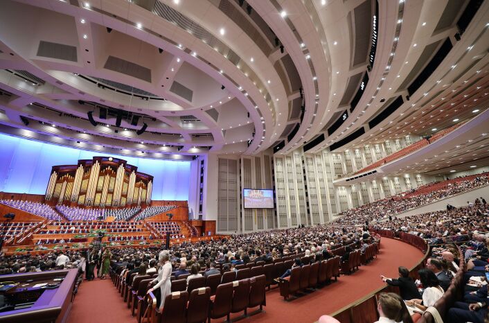 Attendees listen to the Tabernacle Choir at Temple Square during the Saturday morning session of October 2023 general conference.